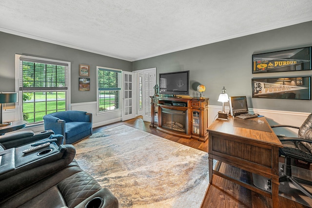 33081 Old Post Rd, Niles, MI 49120 - living area with a textured ceiling, a desk, a wainscoted wall, crown molding, and wood finished floors