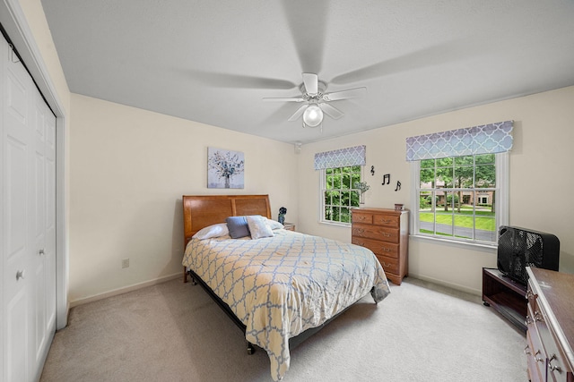 33081 Old Post Rd, Niles, MI 49120 - bedroom with light colored carpet, baseboards, a closet, and a ceiling fan