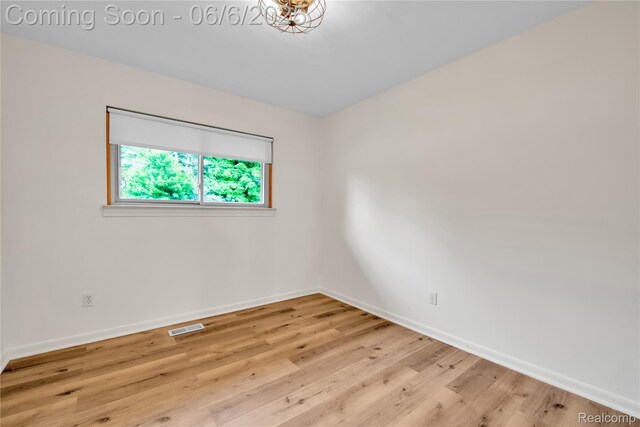 6927 Snow Apple Dr, Clarkston, MI 48346 - empty room with baseboards and wood finished floors