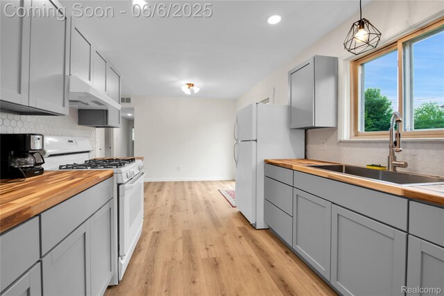 6927 Snow Apple Dr, Clarkston, MI 48346 - kitchen featuring butcher block counters, white appliances, gray cabinetry, and recessed lighting