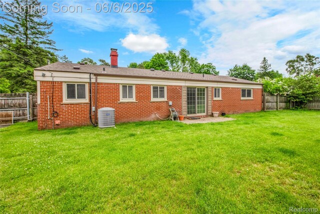 6927 Snow Apple Dr, Clarkston, MI 48346 - back of property featuring central AC, brick siding, and a chimney