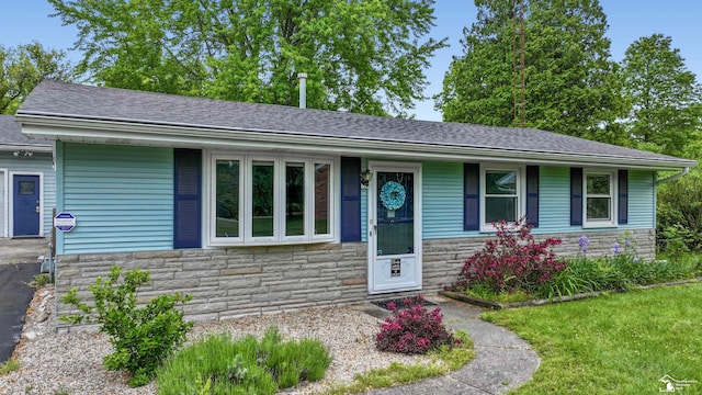 9730 Douglas Rd, Temperance, MI 48182 - ranch-style home with stone siding and roof with shingles