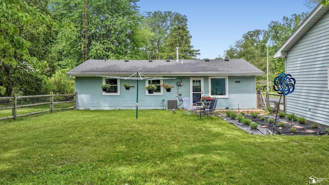 9730 Douglas Rd, Temperance, MI 48182 - rear view of house featuring central AC and a shingled roof