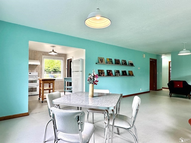 9730 Douglas Rd, Temperance, MI 48182 - dining space featuring a textured ceiling and baseboards