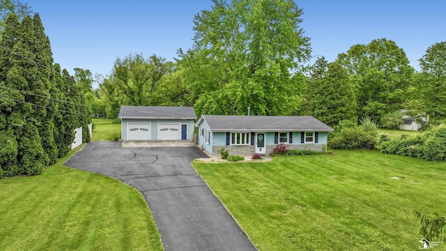 9730 Douglas Rd, Temperance, MI 48182 - view of front facade with a detached garage, a front lawn, and stone siding