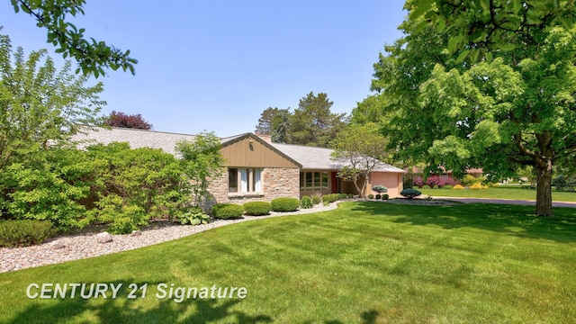 12 W Corral Dr, Saginaw, MI 48638 - ranch-style home featuring a front yard, stone siding, and a chimney
