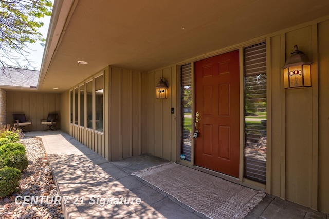 12 W Corral Dr, Saginaw, MI 48638 - doorway to property featuring board and batten siding