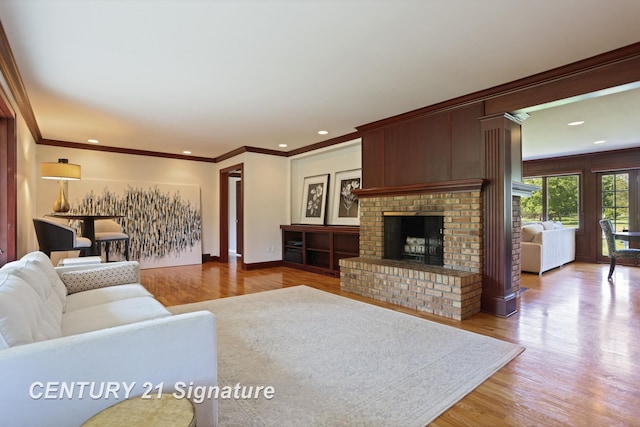 12 W Corral Dr, Saginaw, MI 48638 - living area featuring ornamental molding, wood finished floors, a fireplace, recessed lighting, and baseboards