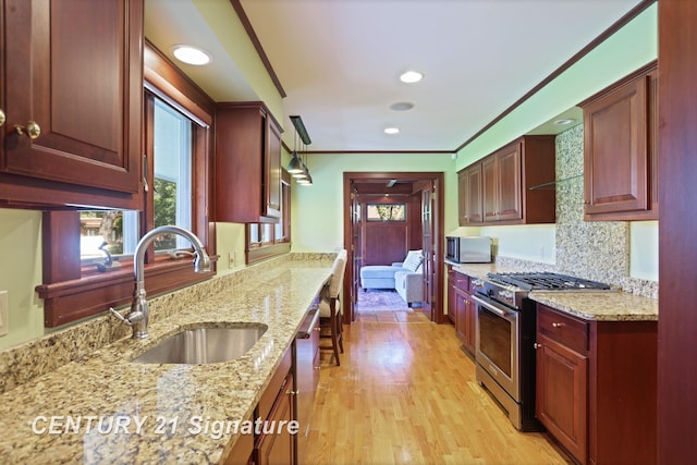 12 W Corral Dr, Saginaw, MI 48638 - kitchen with stainless steel appliances, a sink, plenty of natural light, light wood finished floors, and recessed lighting