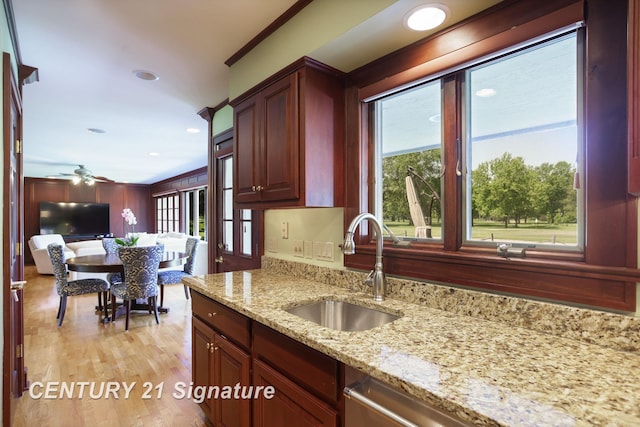 12 W Corral Dr, Saginaw, MI 48638 - kitchen with a sink, light stone counters, dishwasher, ceiling fan, and recessed lighting