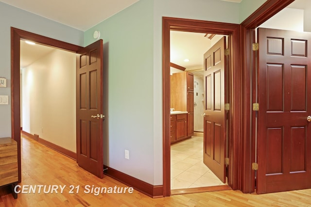 12 W Corral Dr, Saginaw, MI 48638 - corridor featuring light wood-type flooring and baseboards