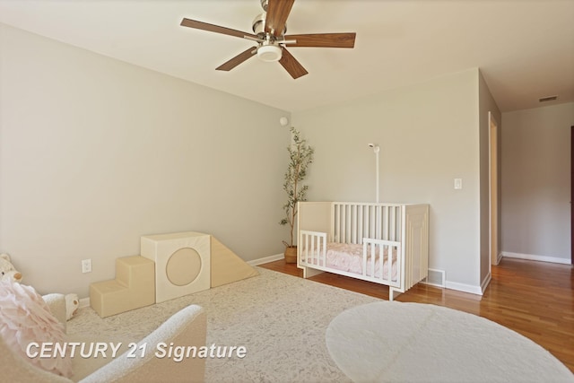 12 W Corral Dr, Saginaw, MI 48638 - bedroom featuring wood finished floors, baseboards, and a ceiling fan