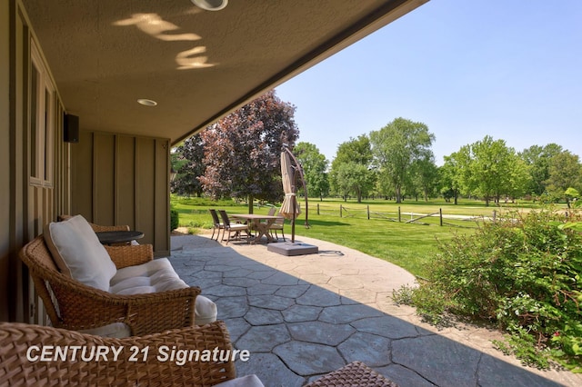 12 W Corral Dr, Saginaw, MI 48638 - view of patio with outdoor dining space and view of scattered trees