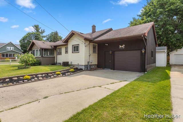 851 Graceland St NE, Grand Rapids, MI 49505 - ranch-style home featuring a chimney, driveway, a front lawn, an attached garage, and roof with shingles