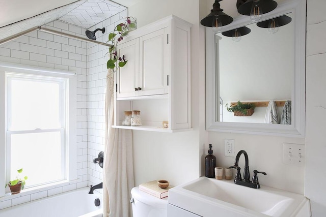 1550 Pine Ave NW, Grand Rapids, MI 49504 - bathroom featuring healthy amount of natural light, shower / tub combo with curtain, and toilet