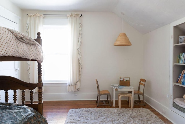 1550 Pine Ave NW, Grand Rapids, MI 49504 - bedroom featuring wood finished floors, vaulted ceiling, and baseboards