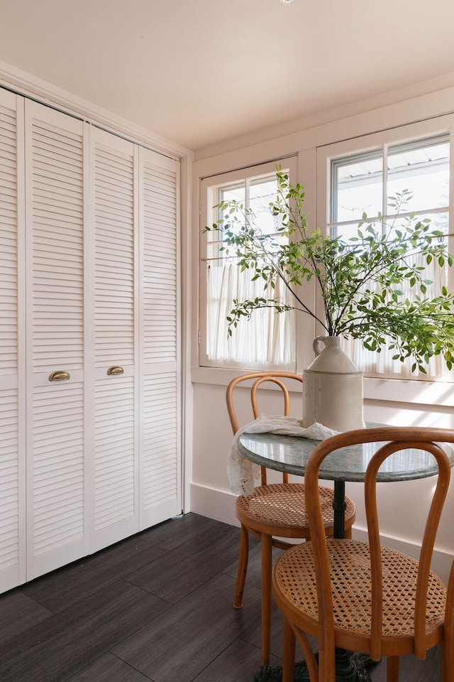 1550 Pine Ave NW, Grand Rapids, MI 49504 - dining area featuring dark wood-style flooring and baseboards