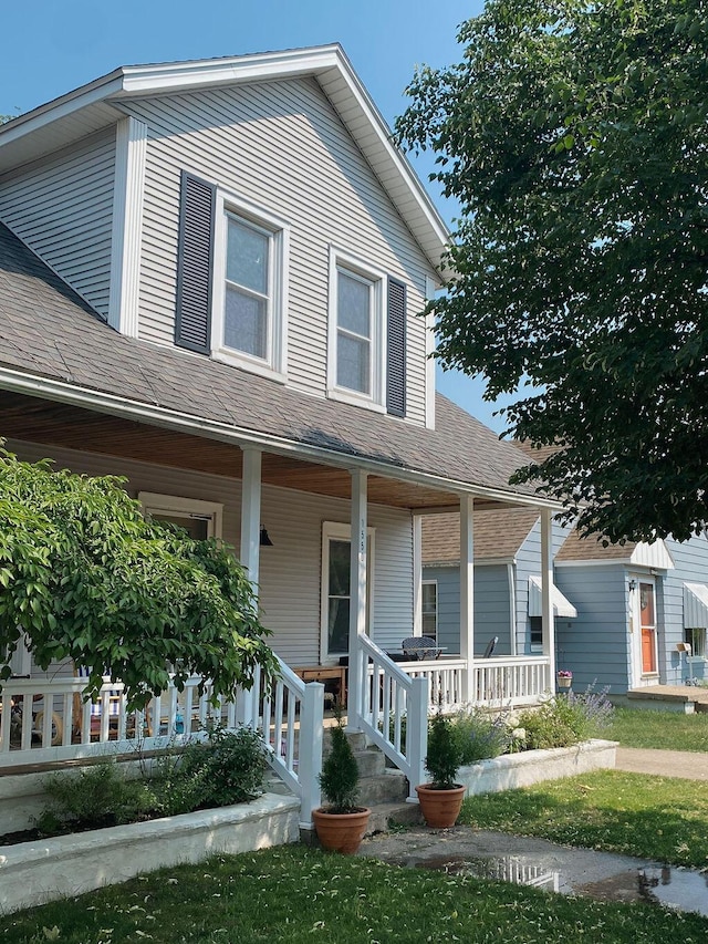 1550 Pine Ave NW, Grand Rapids, MI 49504 - view of front of home with a porch and a shingled roof