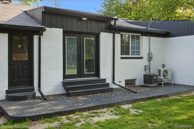 18051 Locherbie Ave, Beverly Hills, MI 48025 - rear view of house featuring entry steps, central air condition unit, brick siding, french doors, and ac unit