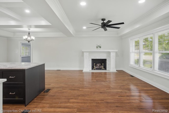 18051 Locherbie Ave, Beverly Hills, MI 48025 - unfurnished living room featuring a ceiling fan, a chandelier, wood finished floors, ornamental molding, and a fireplace