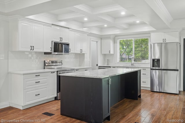 18051 Locherbie Ave, Beverly Hills, MI 48025 - kitchen featuring appliances with stainless steel finishes, wood finished floors, white cabinets, coffered ceiling, and beamed ceiling
