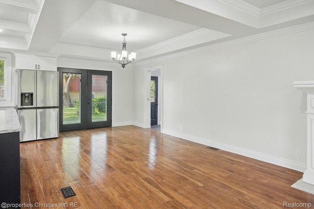 18051 Locherbie Ave, Beverly Hills, MI 48025 - unfurnished dining area featuring plenty of natural light, french doors, a chandelier, wood finished floors, and ornamental molding