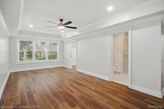 18051 Locherbie Ave, Beverly Hills, MI 48025 - unfurnished bedroom featuring wood finished floors, ornamental molding, baseboards, a tray ceiling, and connected bathroom