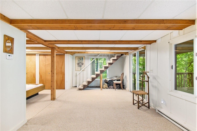 8721 Onandaga Rd, Clarkston, MI 48348 - below grade area featuring a baseboard heating unit, carpet flooring, and stairs