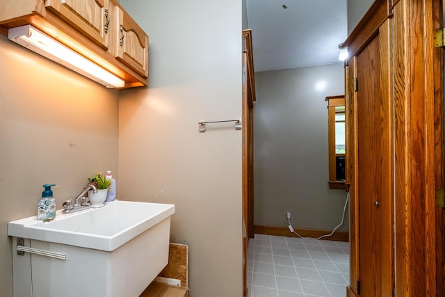 2311 E Glendora Rd, Buchanan, MI 49107 - bathroom with tile patterned flooring and a sink