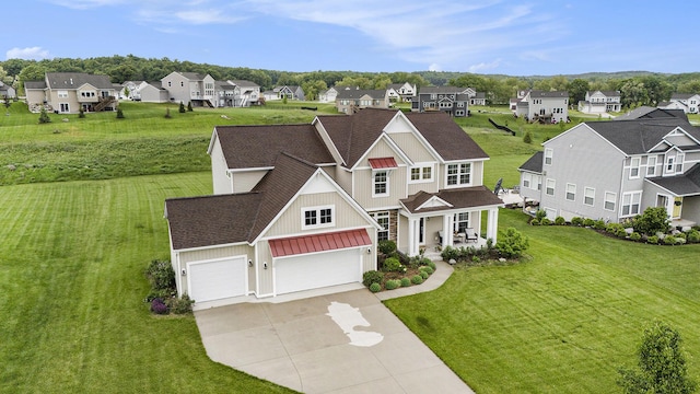 12285 Apple Cart Ln, Lowell, MI 49331 - view of front of house with board and batten siding, a residential view, covered porch, and driveway