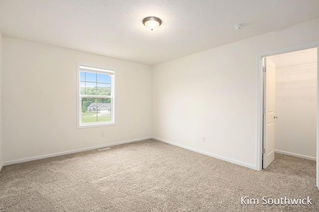 12285 Apple Cart Ln, Lowell, MI 49331 - empty room with carpet floors, baseboards, and a smoke detector