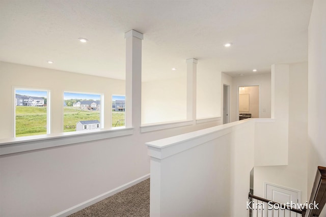 12285 Apple Cart Ln, Lowell, MI 49331 - corridor featuring an upstairs landing, carpet flooring, healthy amount of natural light, baseboards, and recessed lighting