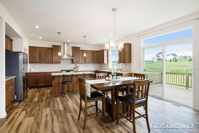 12285 Apple Cart Ln, Lowell, MI 49331 - dining area with wood finished floors, a chandelier, and recessed lighting