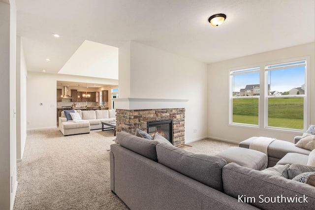 12285 Apple Cart Ln, Lowell, MI 49331 - living area featuring light colored carpet, baseboards, and a brick fireplace