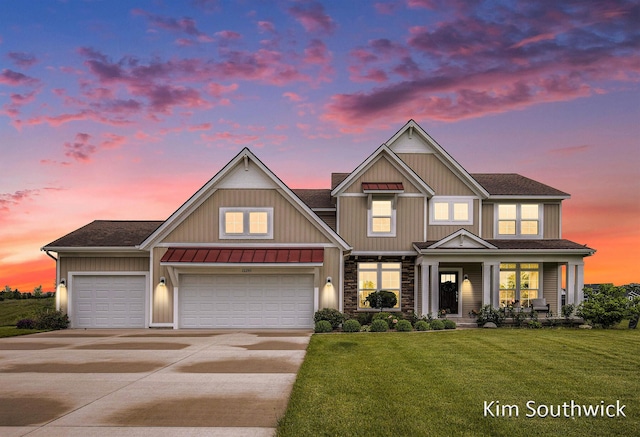 12285 Apple Cart Ln, Lowell, MI 49331 - view of front of home with concrete driveway, a front lawn, a standing seam roof, board and batten siding, and metal roof