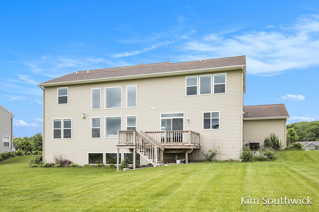 12285 Apple Cart Ln, Lowell, MI 49331 - rear view of house featuring a lawn and a deck