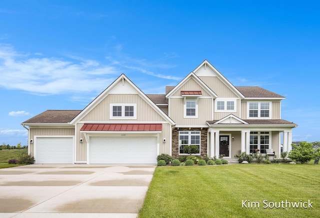 12285 Apple Cart Ln, Lowell, MI 49331 - view of front of property featuring a standing seam roof, driveway, a front lawn, roof with shingles, and metal roof