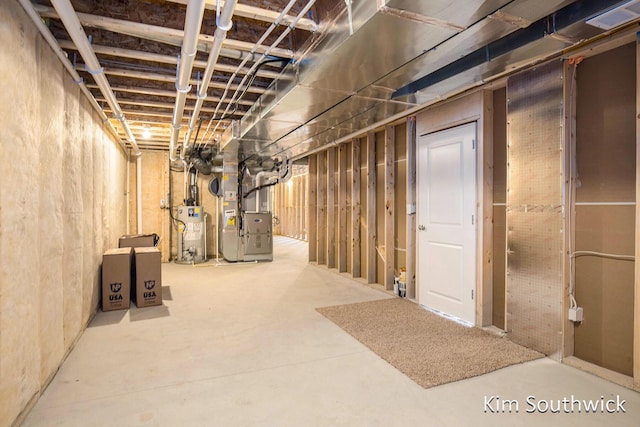 12285 Apple Cart Ln, Lowell, MI 49331 - unfinished below grade area with heating unit and gas water heater