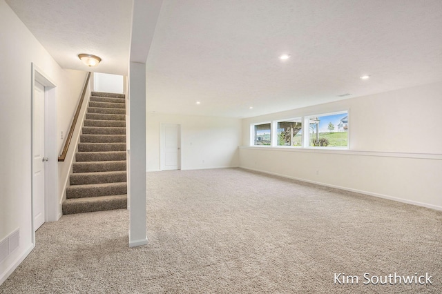 12285 Apple Cart Ln, Lowell, MI 49331 - basement featuring carpet floors, recessed lighting, stairs, and baseboards