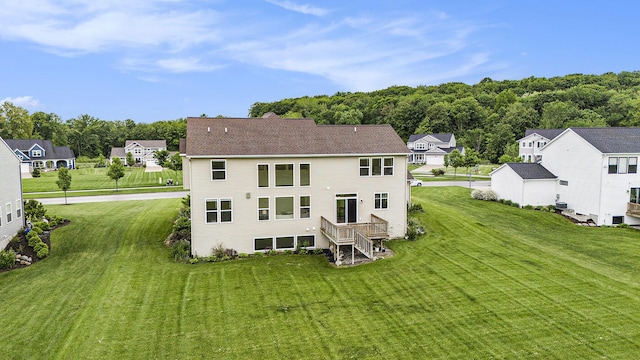 12285 Apple Cart Ln, Lowell, MI 49331 - rear view of house with a yard and a residential view