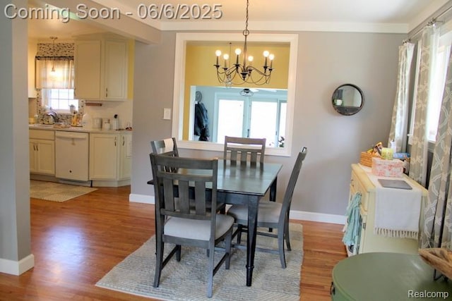 3338 Maple Dr, Melvindale, MI 48122 - dining room featuring a chandelier, light wood-style floors, baseboards, and ornamental molding