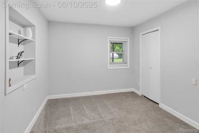 2062 Vermont Dr, Troy, MI 48083 - unfurnished bedroom featuring carpet flooring, baseboards, and a closet