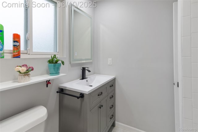 2062 Vermont Dr, Troy, MI 48083 - bathroom with vanity, toilet, and baseboards