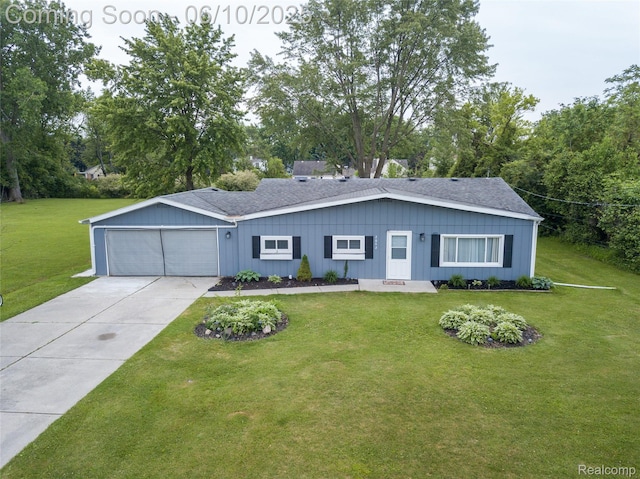 2062 Vermont Dr, Troy, MI 48083 - ranch-style house with a garage, board and batten siding, concrete driveway, and a front yard