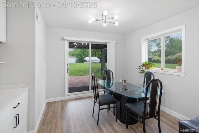 2062 Vermont Dr, Troy, MI 48083 - dining area featuring plenty of natural light, wood finished floors, and baseboards