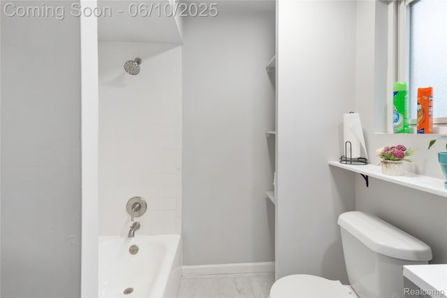 2062 Vermont Dr, Troy, MI 48083 - full bath with toilet, vanity, marble look tiles, washtub / shower combination, and baseboards