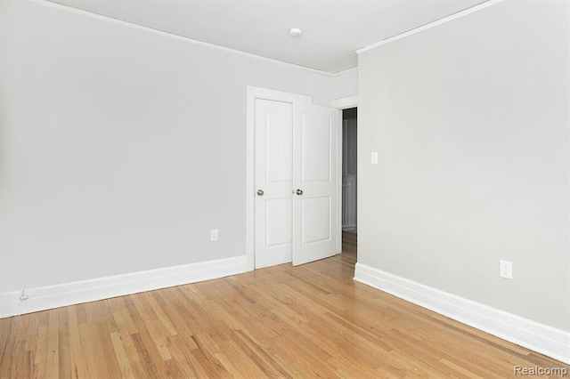 3485 Bedford St, Detroit, MI 48224 - spare room with light wood-style flooring and ornamental molding