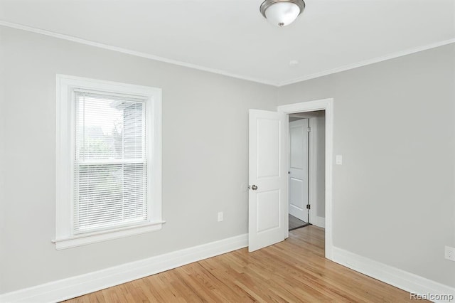 3485 Bedford St, Detroit, MI 48224 - spare room featuring light wood finished floors and ornamental molding