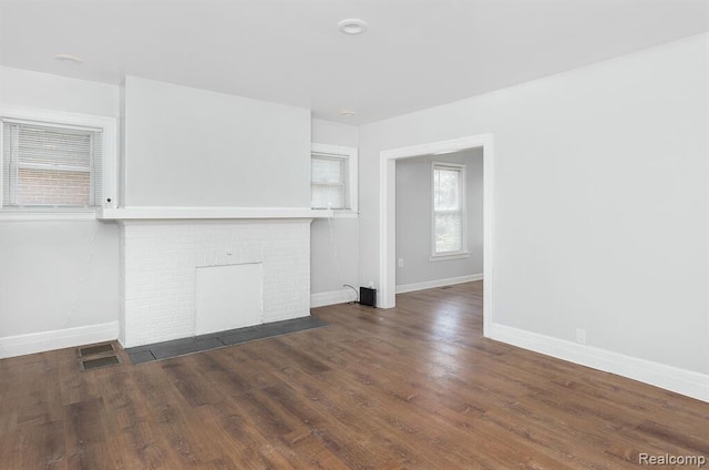 3485 Bedford St, Detroit, MI 48224 - unfurnished living room with a fireplace and wood finished floors