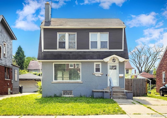 3485 Bedford St, Detroit, MI 48224 - view of front of house with a chimney, brick siding, an outbuilding, and a shingled roof